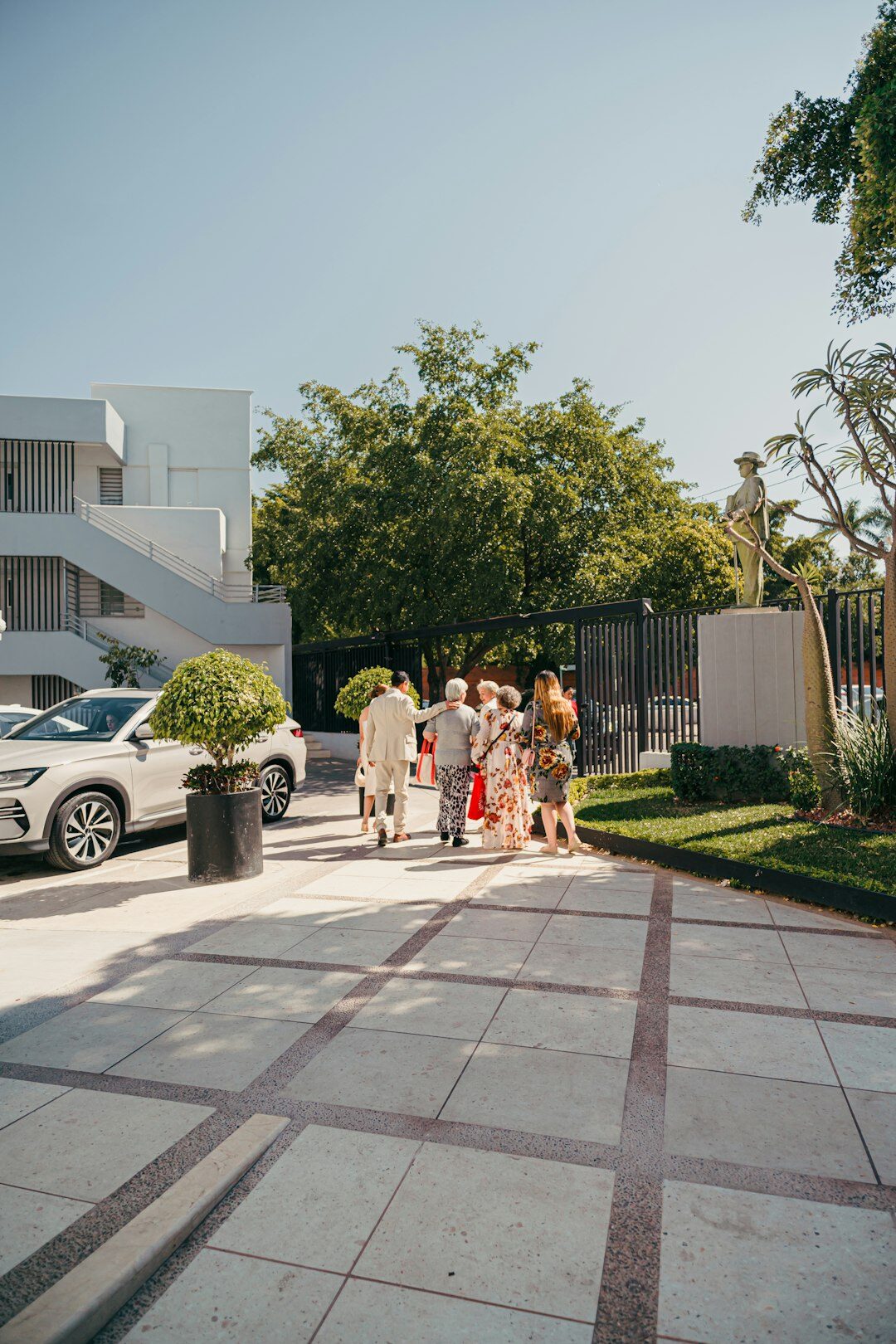 Group of business professionals talking outside a building