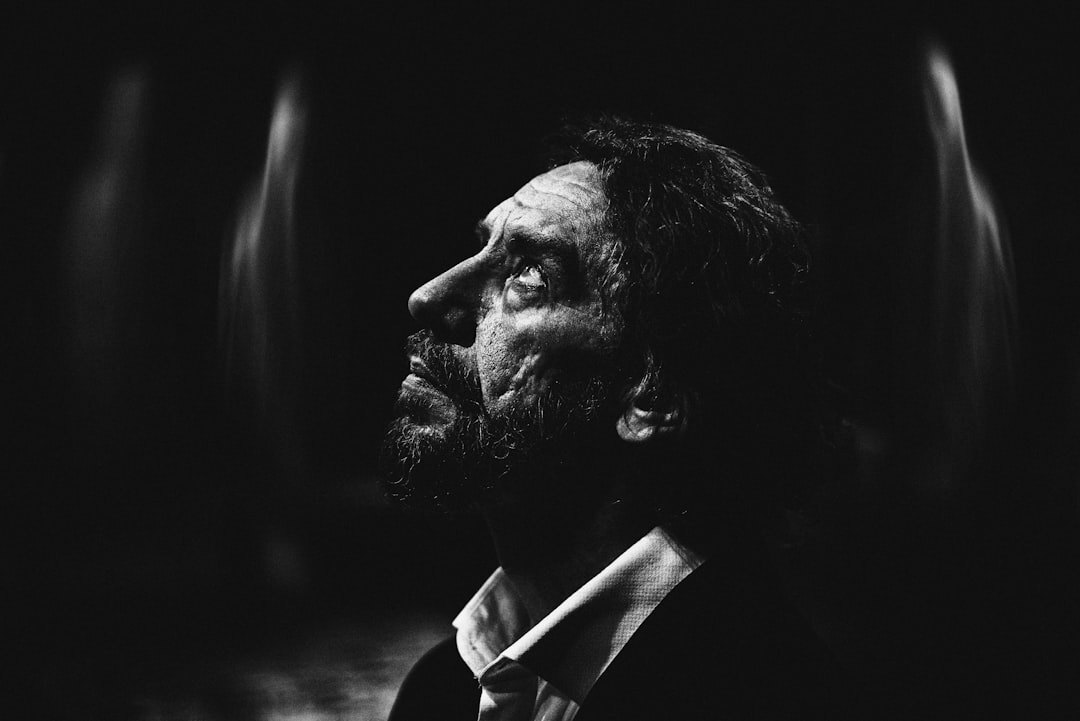 Studio portrait of a bearded man in a suit