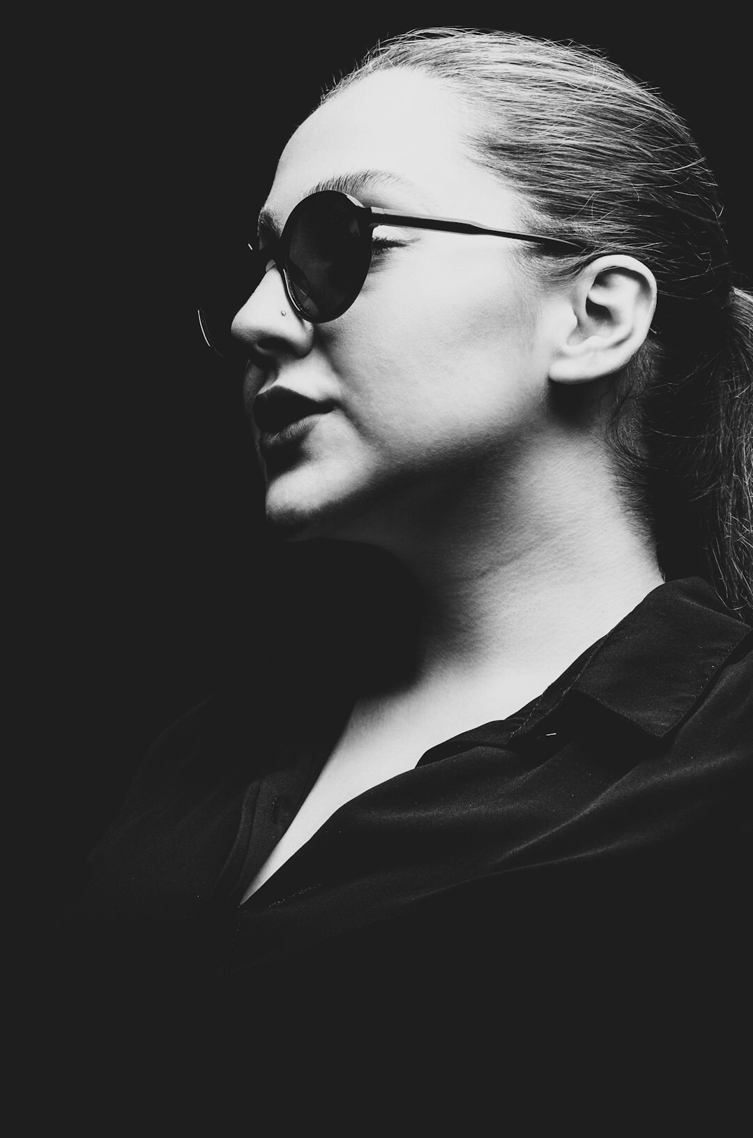 Studio portrait of a professional woman with glasses